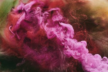 Abstract colorful smoke, dark background. Moving flow of pink paints, fluid art