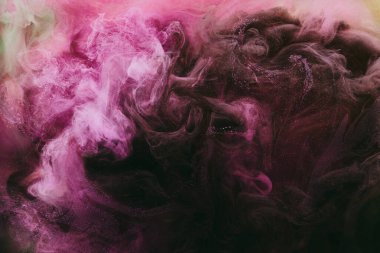 Abstract colorful smoke, dark background. Moving flow of pink paints, fluid art