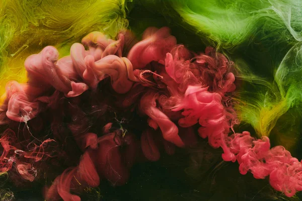 Soyut kırmızı yeşil arka plan. Hareketli duman akışı, sıvı sıvı sanat