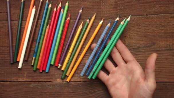 Color pencils on wooden background — Stock Video