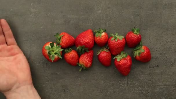 Strawberries falling on a pile — Stock Video