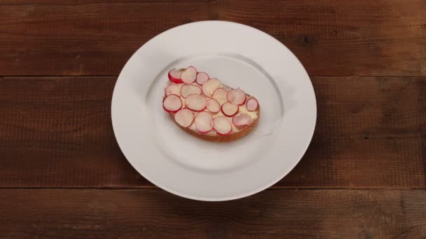 Bread with butter disappears on plate — Stock Video