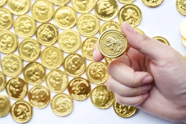 gold coin stack in hand isolated