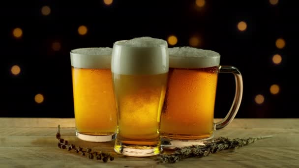3 Glasses of Wheat Beer Splashing on Rustic Wood Table Bar — Stock Video