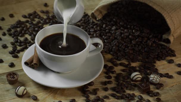 Milk Cream Poured into Black Coffee — Stock Video