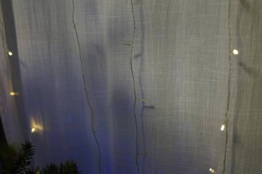 Yumuşak mavi arka planda kumaşlar ve sakinleştirici gölgeler Yeni Yıl 'da aile içi şenlik havası tatili kutlamaları süslüyor. Yüksek kalite fotoğraf