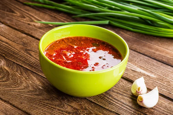 Ukrainian beetroot soup - borscht, on napkin, on wooden backgrou — Stock Photo, Image