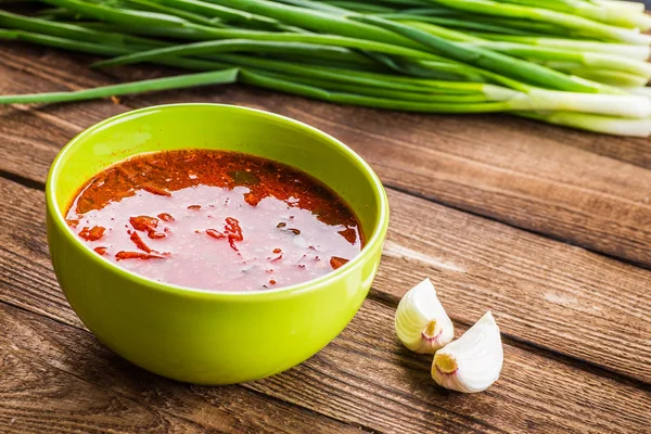 Ukrainian beetroot soup - borscht, on napkin, on wooden backgrou — Stock Photo, Image