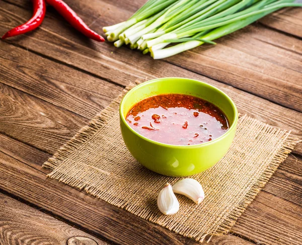 Ukrainian beetroot soup - borscht, on napkin, on wooden backgrou — Stock Photo, Image