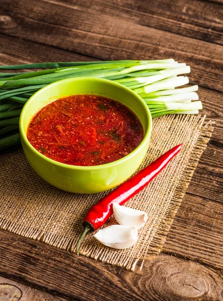 Ukrainian beetroot soup - borscht, on napkin, on wooden backgrou — Stock Photo, Image