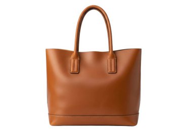 Görüntü şık ve ferah kahverengi deri bir çanta gösteriyor. Parlak ve minimalist bir görünüm ile tasarlanmış. Kolayca taşınmak için iki sağlam, üst kulpu var, rahat bir kavrama sağlıyor. Çantanın düz tabanlı, dikdörtgen şeklinde bir şekli var.