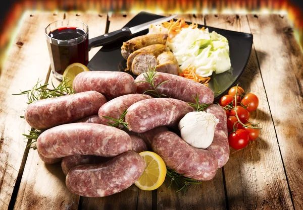 Fresh sausages with various vegetables — Stock Photo, Image