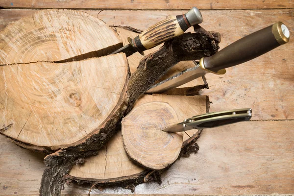 Knives stuck in stumps — Stock Photo, Image