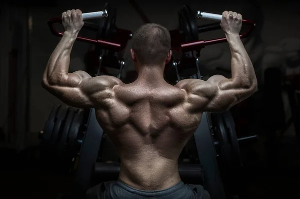 Bodybuilder Handsome Strong Athletic Rough Man Pumping Back Muscles Workout — Stockfoto
