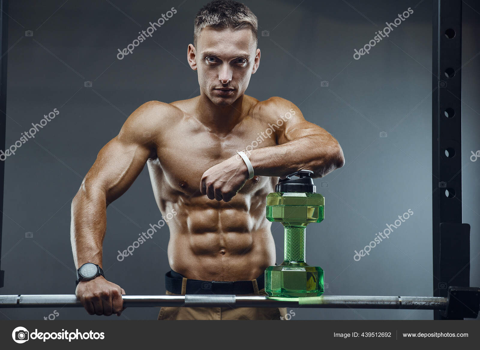 Fitness Man In Gym Drinking Water After Workout. Fitness And Bodybuilding  Healthy Background. Caucasian Men Doing Exercises In Gym Naked Torso. Water  Bottle And Supplements Nutrition Concept Stock Photo, Picture and Royalty