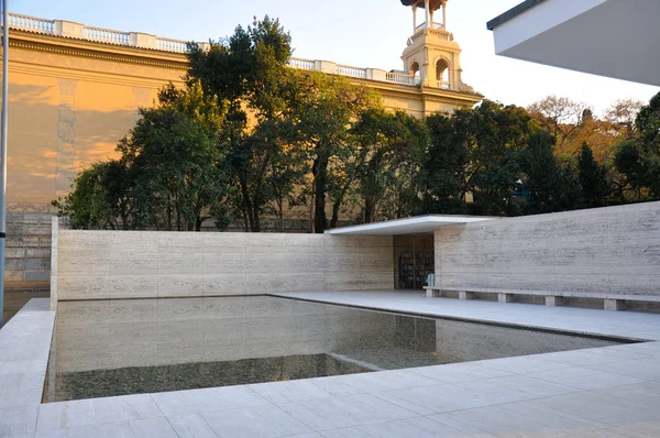 Barcelona Pavilion with tower in the background — Stock Photo, Image