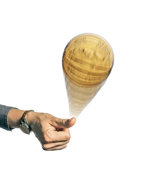 Person's hand throwing up a coin — Stock Photo, Image