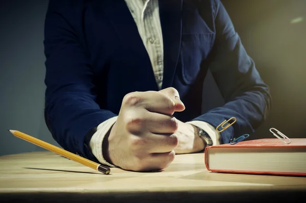 Table with mans fist. — Stock Photo, Image