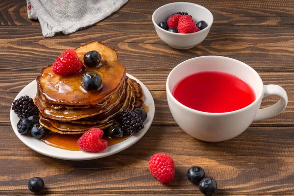 Pancakes Covered Honey Blueberries Strawberries Cup Red Juice Wooden Background — Stock Photo, Image