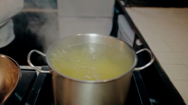 Mid shot Pasta in pan on stove in the kitchen — Stock Video