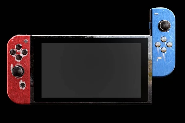 Концептуальні використовувані контролери відеоігор, прикріплені до сенсорного екрану з подряпинами — стокове фото