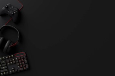 Oyun alanının üst görüntüsü ve fare, klavye, joystick, kulaklık, siyah masa arka planında VR kulaklık gibi teçhizatlar. Canlı yayın konsepti için aksesuarların 3D yorumlaması
