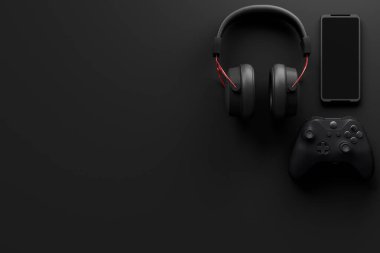 Oyun alanının üst görüntüsü ve fare, klavye, joystick, kulaklık, siyah masa arka planında VR kulaklık gibi teçhizatlar. Canlı yayın konsepti için aksesuarların 3D yorumlaması