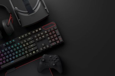 Oyun alanının üst görüntüsü ve fare, klavye, joystick, kulaklık, siyah masa arka planında VR kulaklık gibi teçhizatlar. Canlı yayın konsepti için aksesuarların 3D yorumlaması