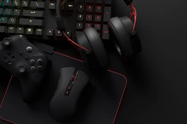 Oyun alanının üst görüntüsü ve fare, klavye, joystick, kulaklık, siyah masa arka planında VR kulaklık gibi teçhizatlar. Canlı yayın konsepti için aksesuarların 3D yorumlaması