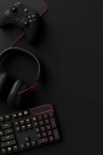 Oyun alanının üst görüntüsü ve fare, klavye, joystick, kulaklık, siyah masa arka planında VR kulaklık gibi teçhizatlar. Canlı yayın konsepti için aksesuarların 3D yorumlaması