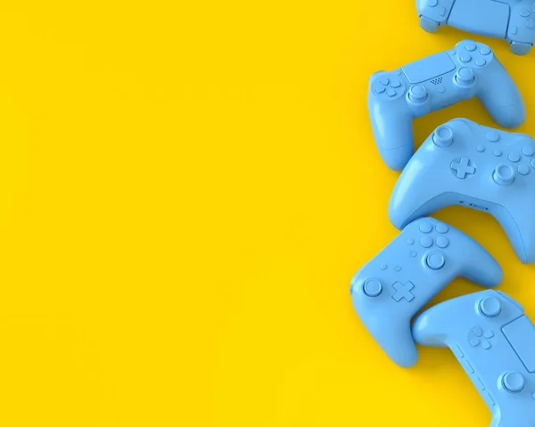 Conjunto de joysticks gamer deitado ou gamepads no fundo amarelo — Fotografia de Stock