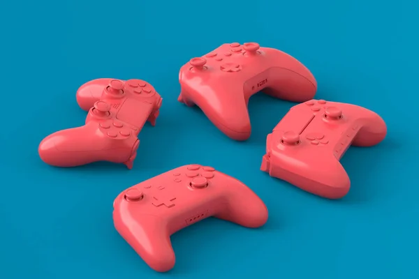 Juego de joysticks o gamepads mentirosos sobre fondo azul y rosa —  Fotos de Stock