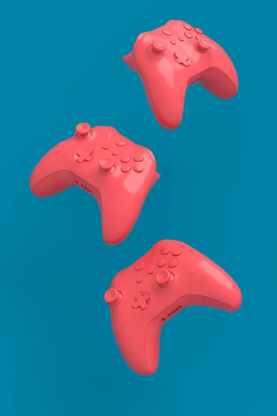 Flying gamer joysticks of gamepads op blauwe en roze achtergrond — Stockfoto