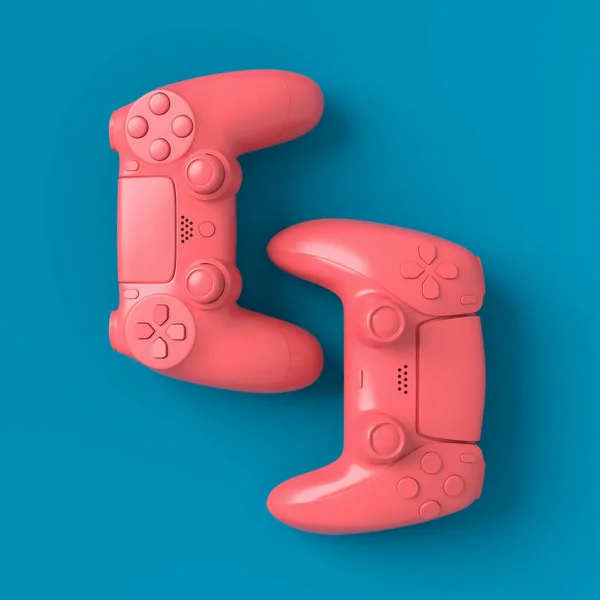 Juego de joysticks o gamepads mentirosos sobre fondo azul y rosa —  Fotos de Stock