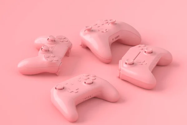 Zestaw kłamliwych joysticków lub gamepadów na różowym tle — Zdjęcie stockowe