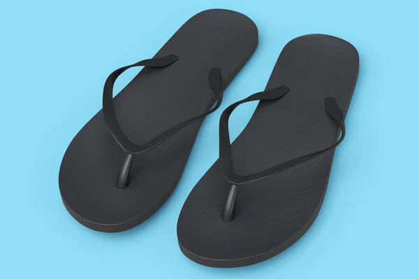 Schwarze Flipflops oder Sandalen am Strand isoliert auf blauem Hintergrund. — Stockfoto