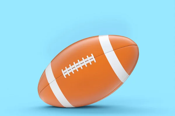 Americký fotbal míč izolované na modrém pozadí — Stock fotografie