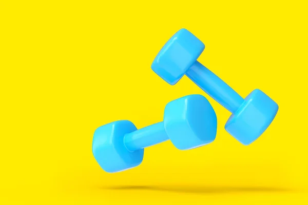Paar rubberen blauwe halters geïsoleerd op gele achtergrond — Stockfoto