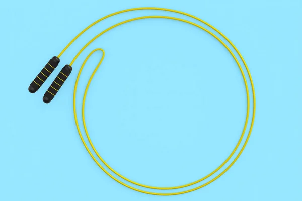 Yellow skipping rope or jumping rope isolated on blue background. — Stock Photo, Image