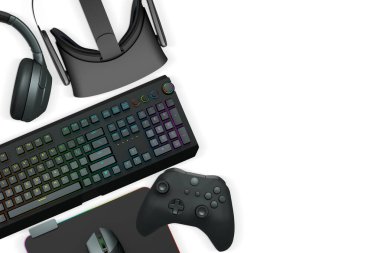 Collection of modern gaming accessories including headset, controller, keyboard, and VR gear isolated on white background with clipping path