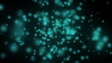 Koyu bir arkaplanda canlı deniz mavisi bokeh etkisi.