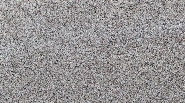 Çeşitli projeler için ideal gri kum dokusunun yakın plan görüntüsü.