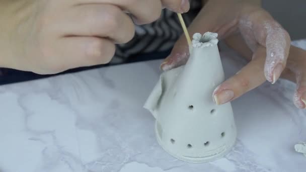 Female potter hands working with clay in workshop on marble table. — Stock Video