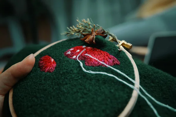 Embroidery process with cotton thread of mushrooms hat. — Stock Photo, Image