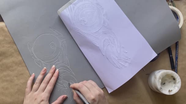 Womens hands cut out patterns with stationery knife from sheet of eva foam. — Wideo stockowe