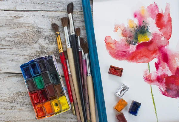 Watercolor paint, brush, painted flowers. — Stock Photo, Image