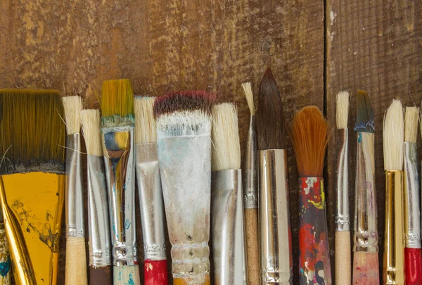 Brushes on a wooden background. — Stock Photo, Image