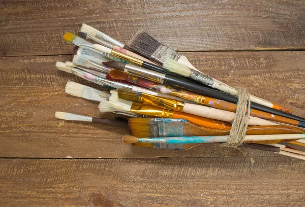 Brushes on a wooden background. — Stock Photo, Image