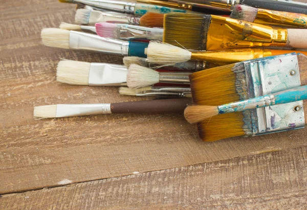 Brushes on a wooden background. — Stock Photo, Image