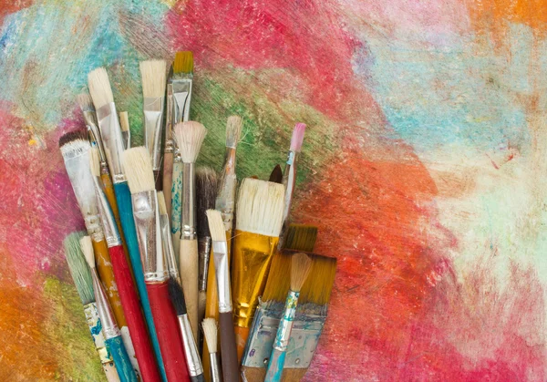 Brushes on a colorful background. — Stock Photo, Image